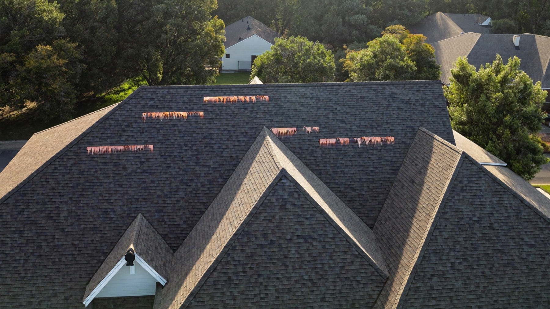 Aerial view of a completed Redbud roof with crisp ridge lines